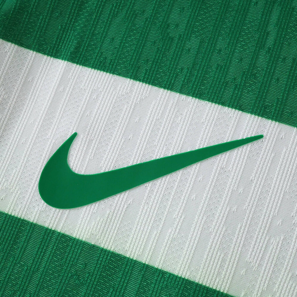 Close-up of the Sporting CP 2025/26 home player version jersey showing green Nike logo on green and white stripe.