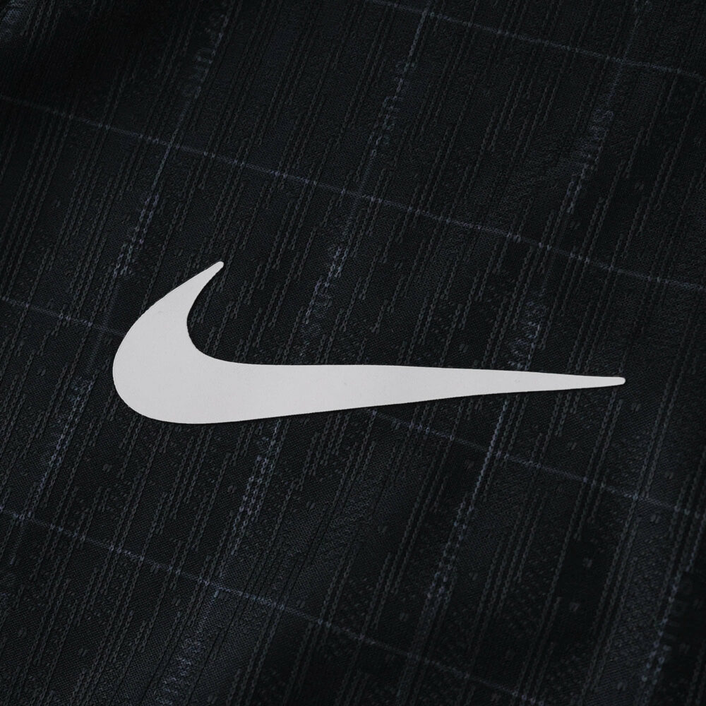 Close-up of the Nike logo on the Tottenham Hotspur 2025/26 away player version jersey fabric.