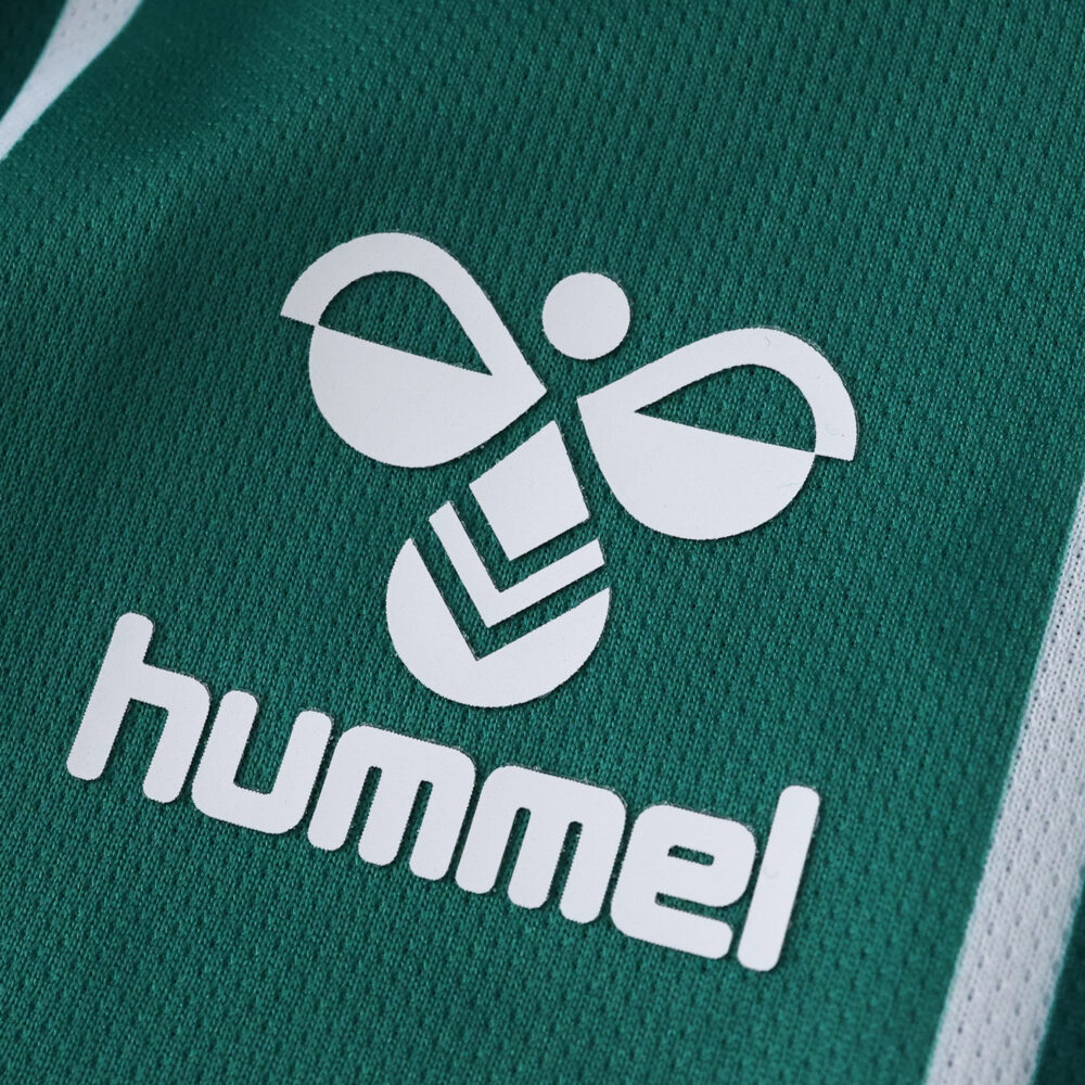 Close-up of the Hummel logo on the green Werder Bremen 2025/26 Home Fan Version jersey.