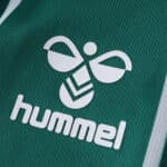 Close-up of the Hummel logo on the green Werder Bremen 2025/26 Home Fan Version jersey.