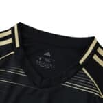 Close-up of the collar and shoulders of the Aberdeen Away 2025/26 Fan Version jersey, showing gold accents.