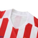 Close-up of Atlético Madrid Home 2025/26 Player Version jersey collar with red and white stripes.