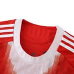 Close-up of Bayern Munich 2025/26 home player version jersey collar with red and white details.