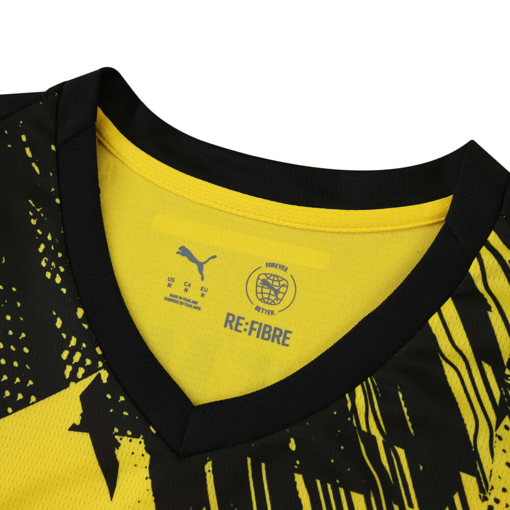 Close-up of Borussia Dortmund 2025/26 Home Fan jersey collar with Puma logo and black-yellow design.