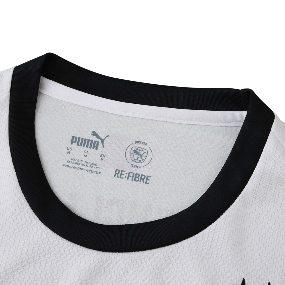 Close-up of the 2025/26 Borussia Monchengladbach home fan jersey collar with Puma and Re-Fibre logos.