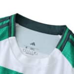 Close-up of the collar and shoulder details on the Celtic Home 2025/26 Fan Version jersey.