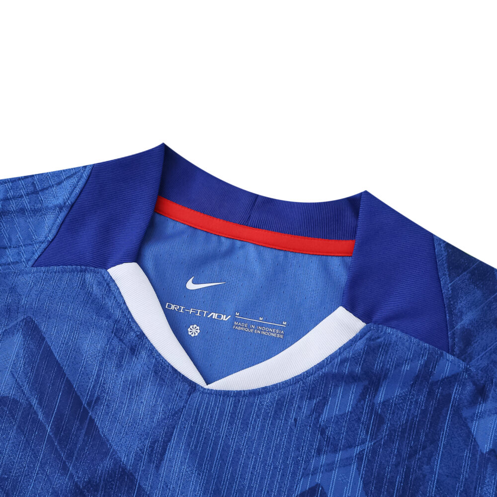 Close-up of Chelsea Home 2025/26 Player Version jersey collar in blue with Nike logo on the tag.