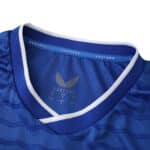 Close-up of the Everton 2025/26 home fan jersey collar in blue with white trim and Castore branding.