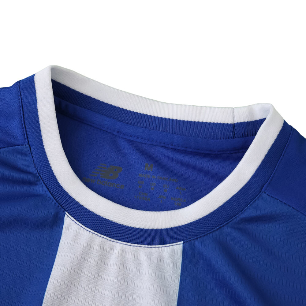 Close-up of the FC Porto 2025/26 home fan jersey collar featuring blue and white stripes.
