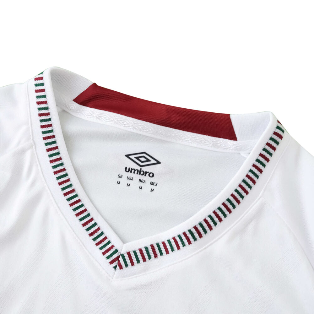 Close-up of Fluminense 2025/26 Away Fan Version jersey collar with green, red, and white trim.