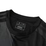 Close-up of Inter Miami CF Away 2025/26 Fan Version jersey collar and Adidas size label.