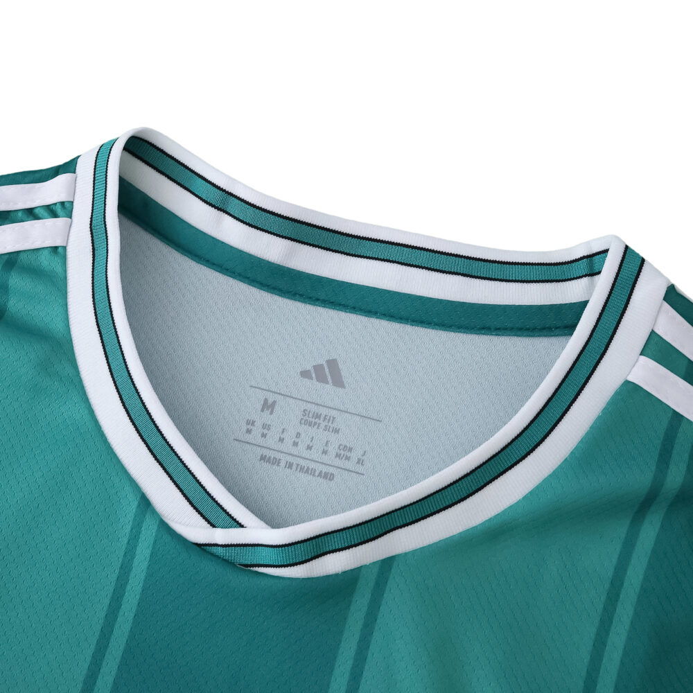 Close-up of the collar and shoulder of the Liverpool Third 2025/26 Fan Version jersey in teal with white accents.