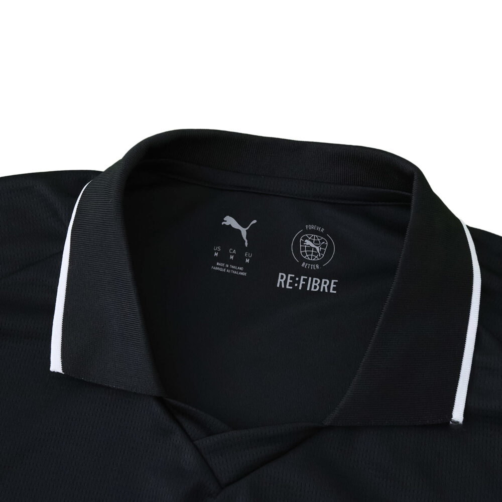 Close-up of collar on Manchester City Away 2025/26 Fan Version jersey, black with white trim and Puma branding.