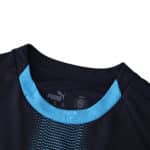 Close-up of Olympique Marseille Away 2025/26 Fan Version jersey, showing collar and fabric detail.