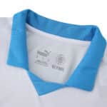 Close-up of the Olympique Marseille 2025/26 home fan jersey collar in white with a blue trim.