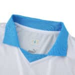 Close-up of Olympique Marseille 2025/26 Home Player Version jersey collar with blue trim and Puma logo.