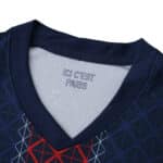 Close-up of the Paris Saint-Germain 2025/26 Home Fan Version jersey collar with "ICI C'EST PARIS" text.