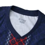 Close-up of Paris Saint-Germain 2025/26 Home Player Version jersey collar with "ICI C'EST PARIS" text inside.
