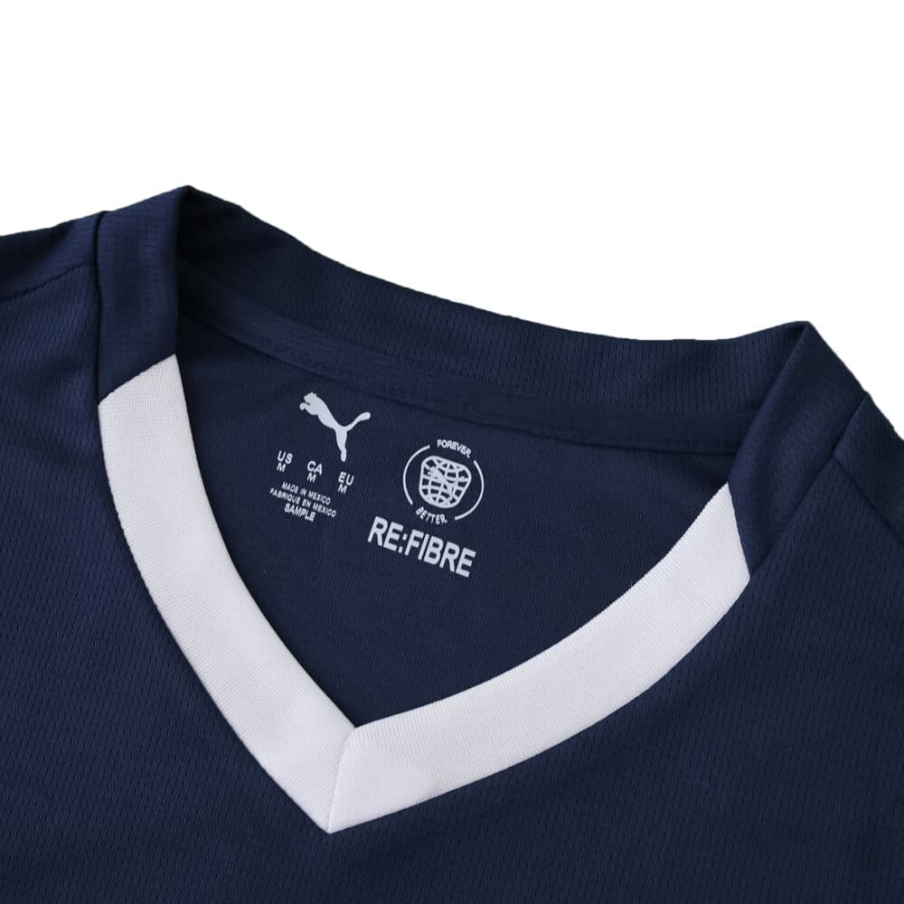 Close-up of PSV Eindhoven 2025/26 away fan jersey collar with white V-neck and Puma branding.