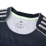 Close-up of the Real Madrid 2025/26 away fan jersey collar with Adidas logo and size label.