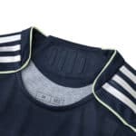 Collar detail of the Real Madrid Away 2025/26 Player Version jersey in dark blue with white stripes.