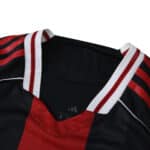 Close-up of River Plate Away 2025/26 Player Version jersey collar with red and white striped details.