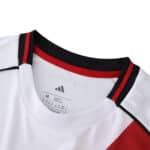 Close-up of River Plate 2025/26 Home Fan Version jersey collar with red, black, and white details.