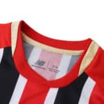 Close-up of São Paulo Away 2025/26 Fan Version jersey collar with red, black, and white stripes.