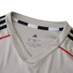 Close-up of SL Benfica Away 2025/26 Fan Version jersey collar with Adidas logo and black shoulder stripes.