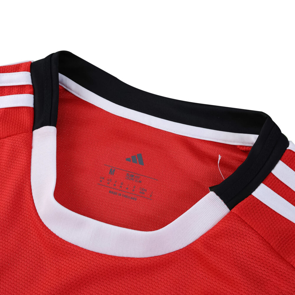 Close-up of SL Benfica 2025/26 Home Fan Version jersey collar with Adidas logo and white accents.
