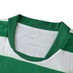Close-up of Sporting CP 2025/26 home player version jersey collar with green and white stripes.