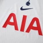 Close-up of Tottenham Hotspur 2025/26 Home Player Version jersey with red "AIA" sponsor and club crest.