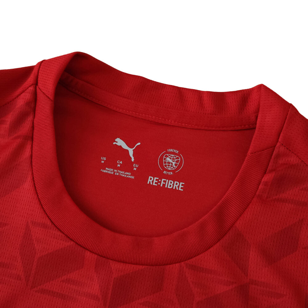 Close-up of the collar and upper chest of the Valencia Away 2025/26 Fan Version jersey in red.
