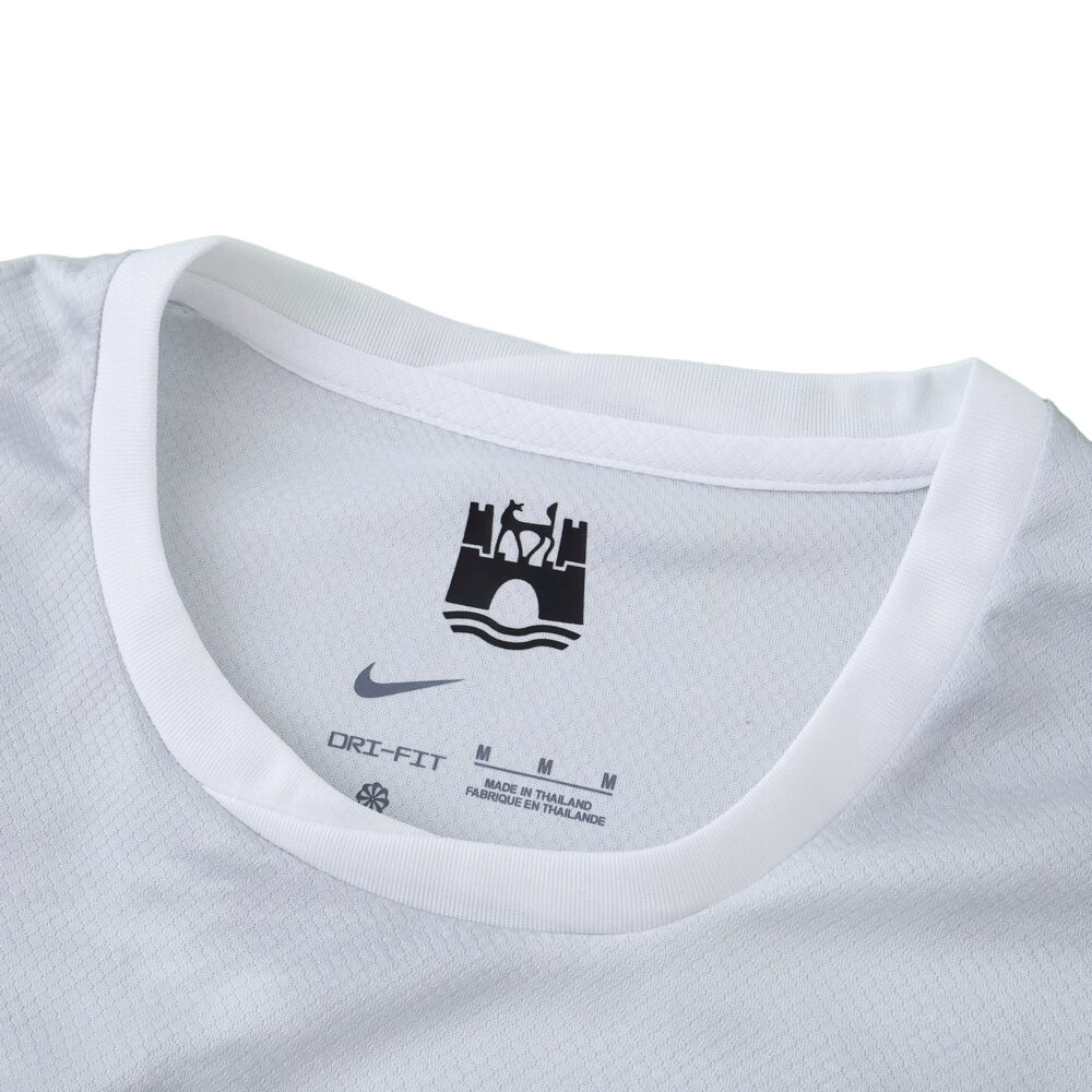Close-up of the collar on VfL Wolfsburg Away 2025/26 Fan Version jersey, featuring Nike and club details.