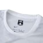 Close-up of the collar on VfL Wolfsburg Away 2025/26 Fan Version jersey, featuring Nike and club details.