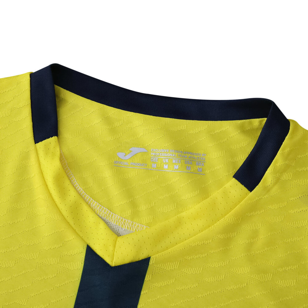Close-up of the Villarreal 2025/26 home player version jersey collar in yellow with navy accents.
