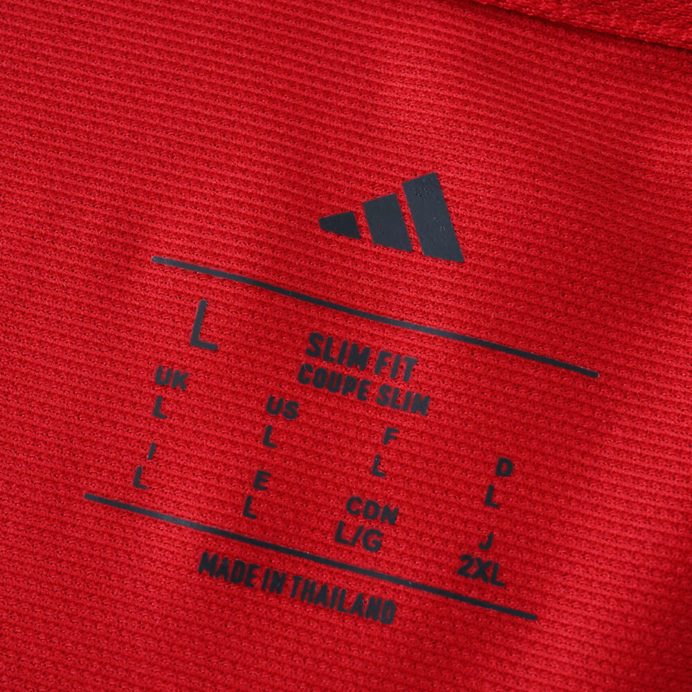 Close-up of the inner neck label on the Ajax Home 2025/26 Fan Version jersey showing size and fit details.