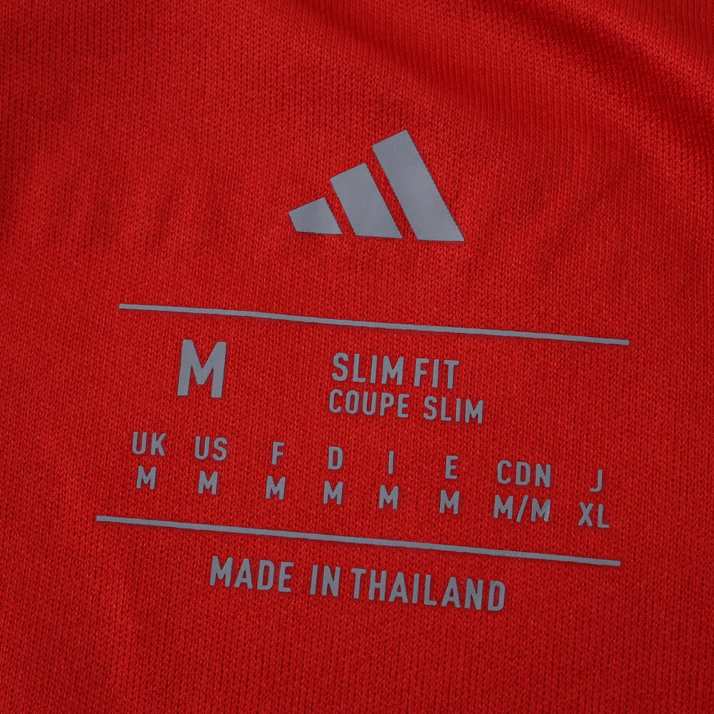 Arsenal Home 2025/26 Fan Version jersey size label showing medium, slim fit, and made in Thailand.