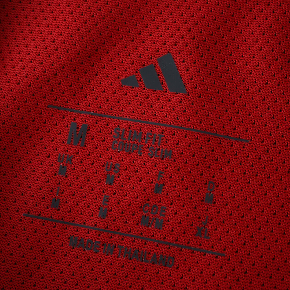 Close-up of the inner collar label on the 2025/26 Arsenal Home Player Version jersey, showing Adidas branding.