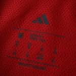 Close-up of the inner collar label on the 2025/26 Arsenal Home Player Version jersey, showing Adidas branding.