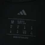 Close-up of the inner neck label showing Aston Villa Away 2025/26 Player Version sizing and Adidas logo.