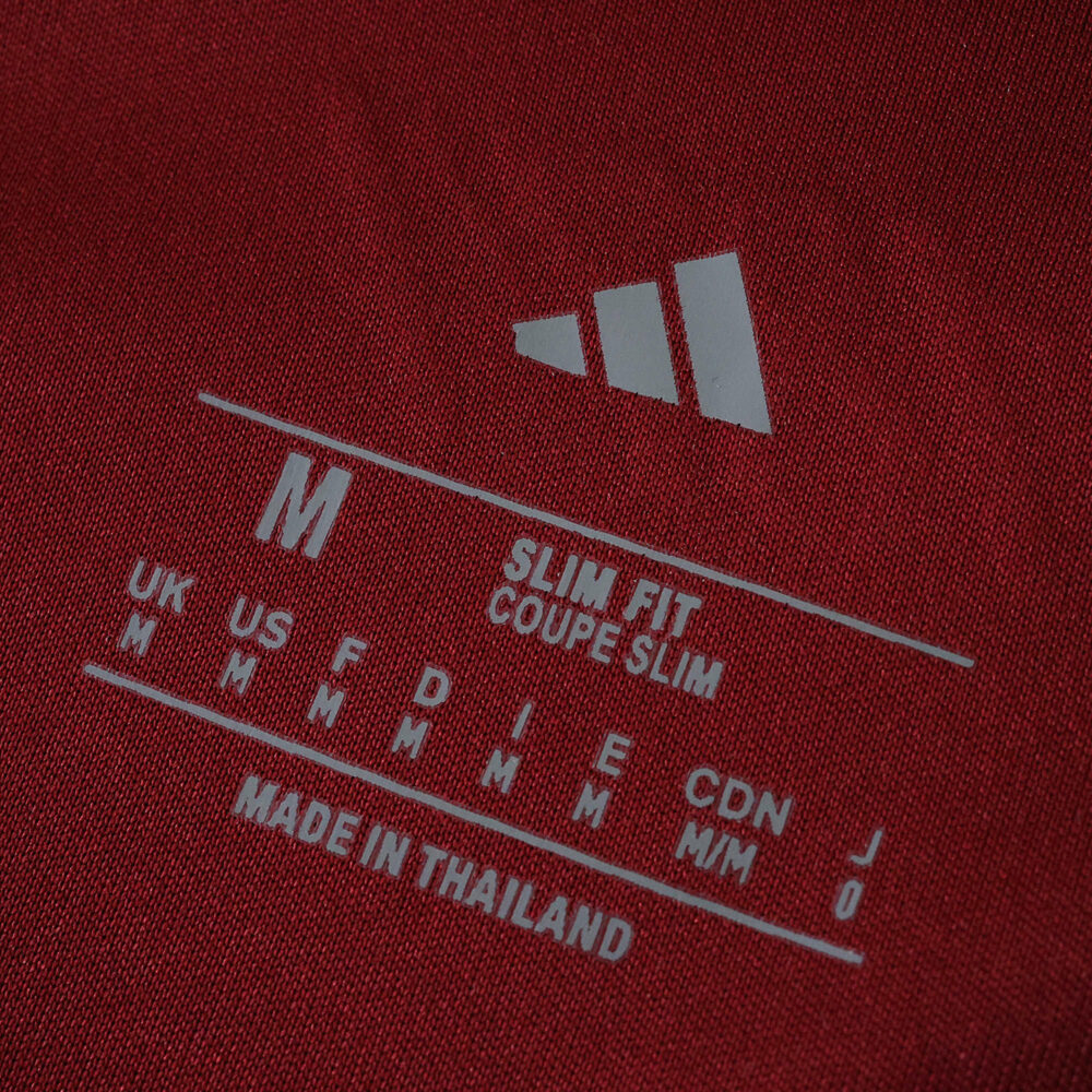 Size label showing "Slim Fit", medium size, and Adidas logo on Aston Villa Home 2025/26 Fan Version jersey.
