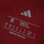 Size label showing "Slim Fit", medium size, and Adidas logo on Aston Villa Home 2025/26 Fan Version jersey.
