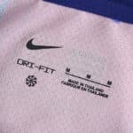 Close-up of the collar inner tag on the Barcelona 2025/26 Fan Version jersey, showing size and branding details.