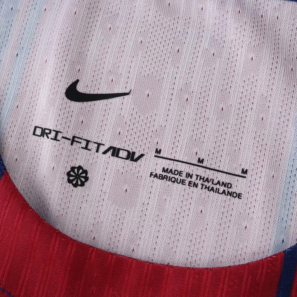 Close-up of the inner collar on Barcelona Home 2025/26 Player Version jersey showing Nike branding and product details.