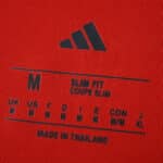 Bayern Munich 2025/26 Home Fan Jersey size label, showing medium, slim fit, and made in Thailand.