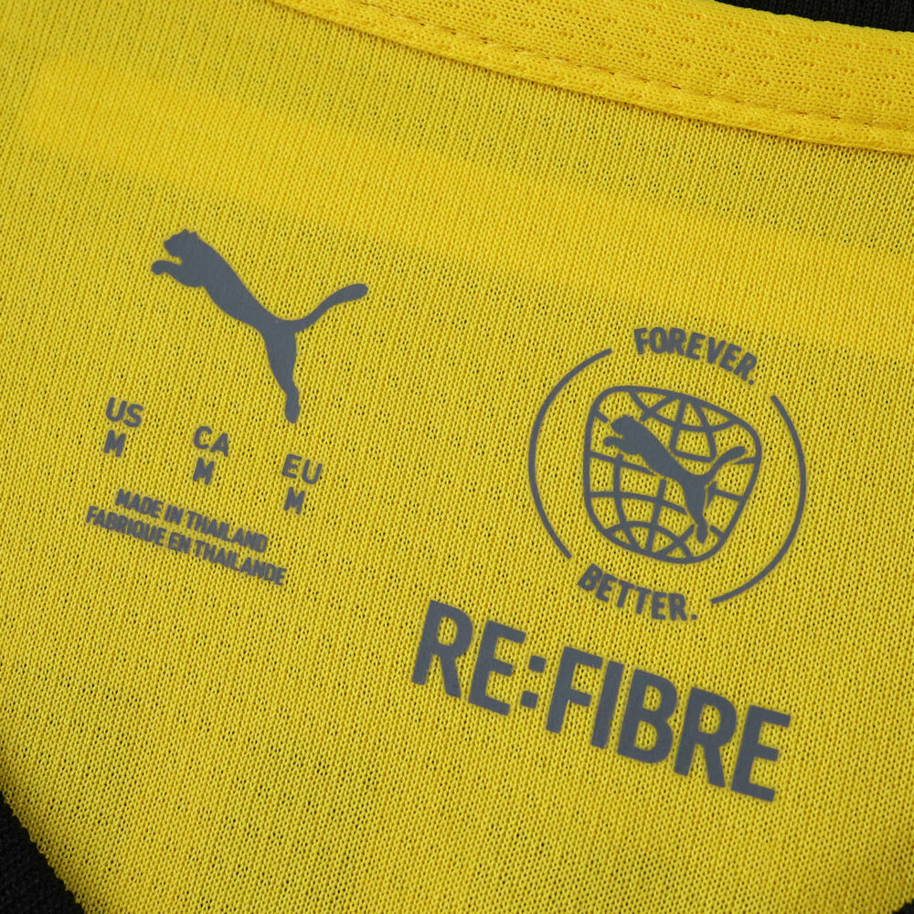 Close-up of inner collar on 2025/26 Borussia Dortmund Home Fan Jersey, showing Puma and RE:FIBRE logos.