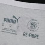 Inner neck label of Borussia Monchengladbach 2025/26 home fan jersey showing Puma and RE:FIBRE branding.