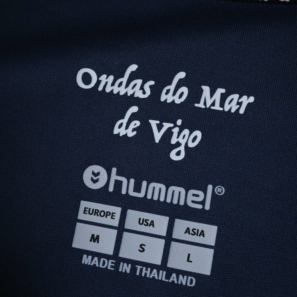 Close-up of the inner label on the Celta Vigo Away 2025/26 Fan Version jersey, showing sizing and branding.