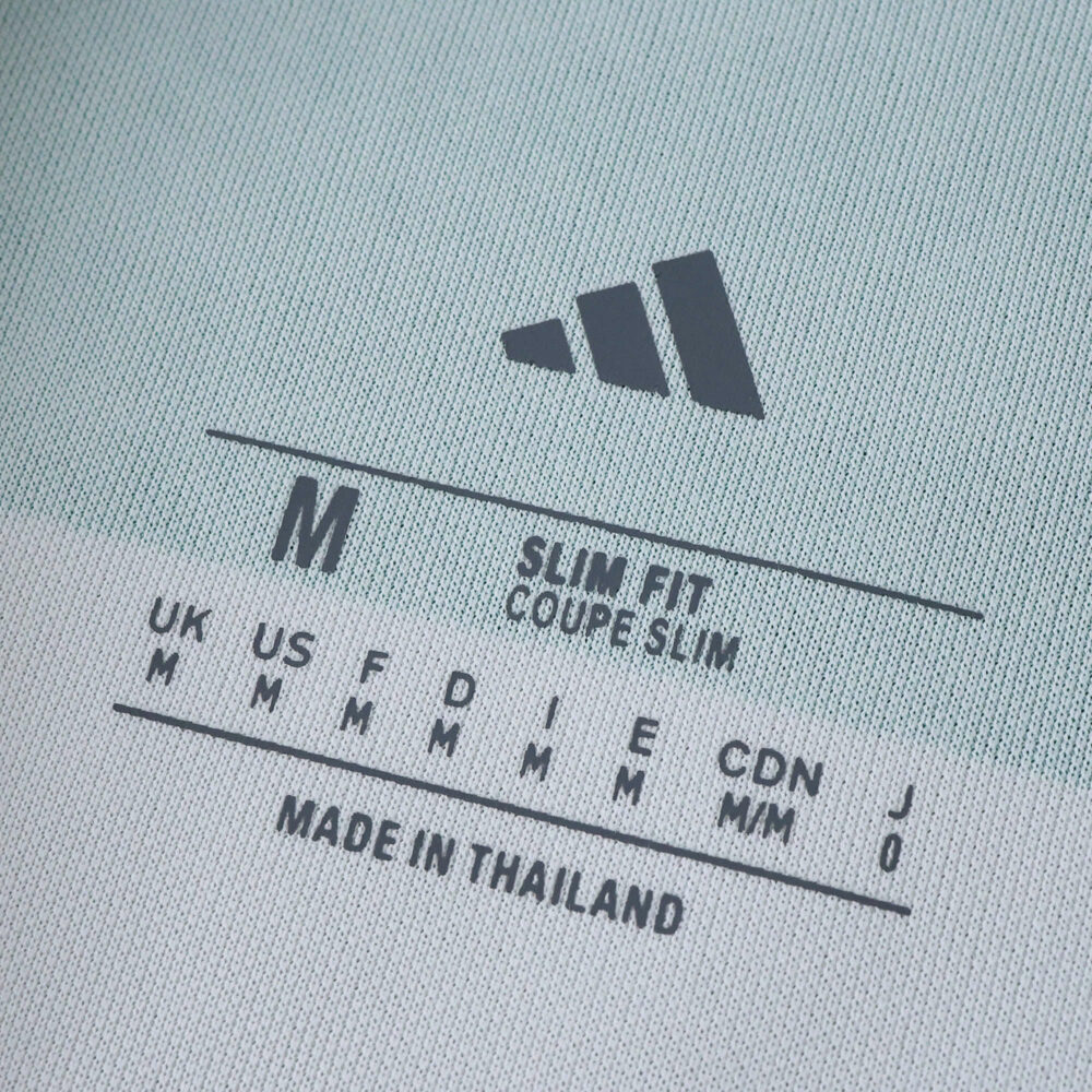 Close-up of the inner label on a Celtic Home 2025/26 Fan Version shirt, showing size and fit details.